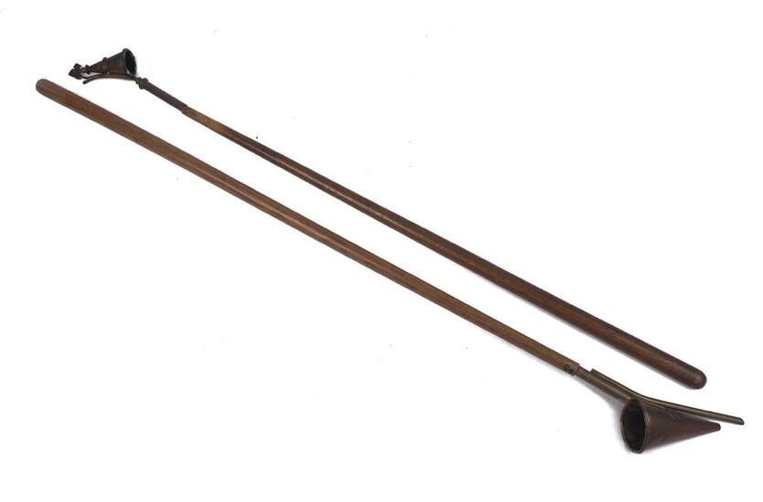 Two long-arm oak and brass church candle snuffers, early 20th century, 103cm and 94cm long (2)