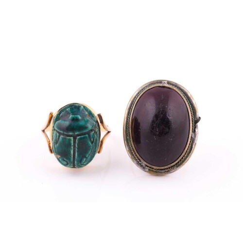 Two rings, comprising an early 20th century gold and green f...