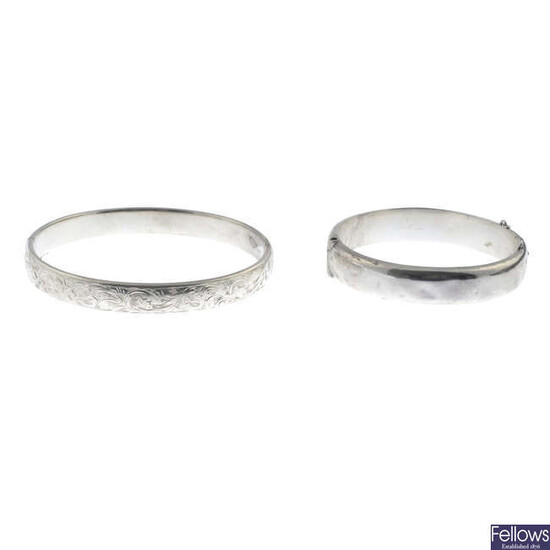 Two silver hinged bangles.