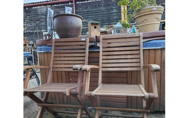 Two solid wood folding garden chairs