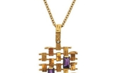 An abstract gold pendant, set with two emerald cut…
