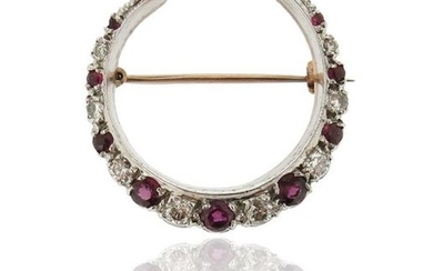 A ruby and diamond closed crescent brooch, set...