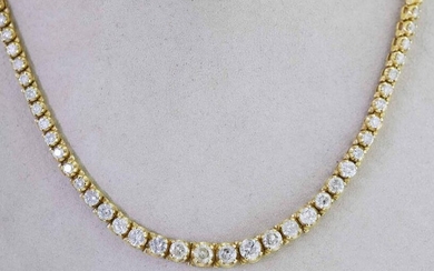 14KT YELLOW GOLD GRADUATED DIAMOND LINE NECKLACE.