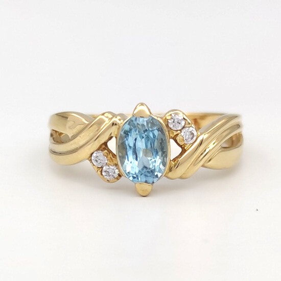 18 kt yellow gold ring with zircons and 1 ct topaz