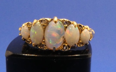 18ct yellow gold ring set with 5 oval graduated opals,...