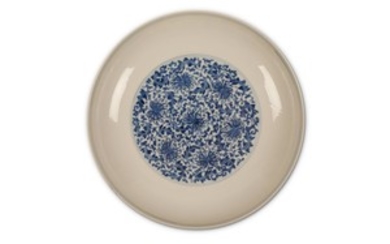 A CHINESE BLUE AND WHITE ‘PEONY SCROLL’ DISH....