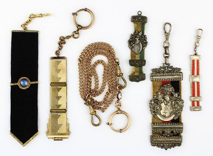 3 student beer tails, 2 jewellery beer tails, 1 watch slider and 1 watch chain: 1 large tail with German flag band, silver crest with crest and helmet and ligated monogram EM, engraved Rich. Kratzsch v. Achilles s/b Ludw. Schmidt v. Faß, S. p. 1907; 1...