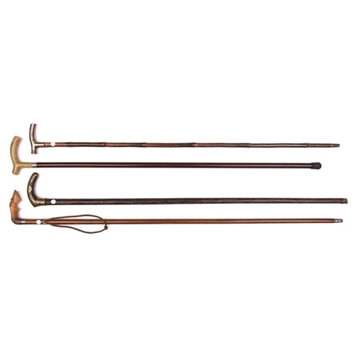 4 slender walking sticks: dark wood with iron handle decorat...