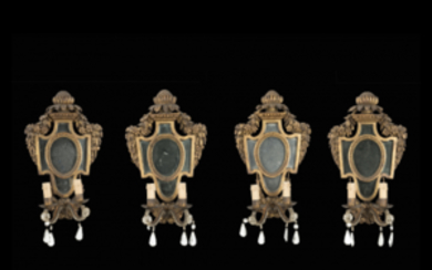 A group of four two-light appliques. 18th century. Metal candle holders of a later date (cm 44x27) (defects)