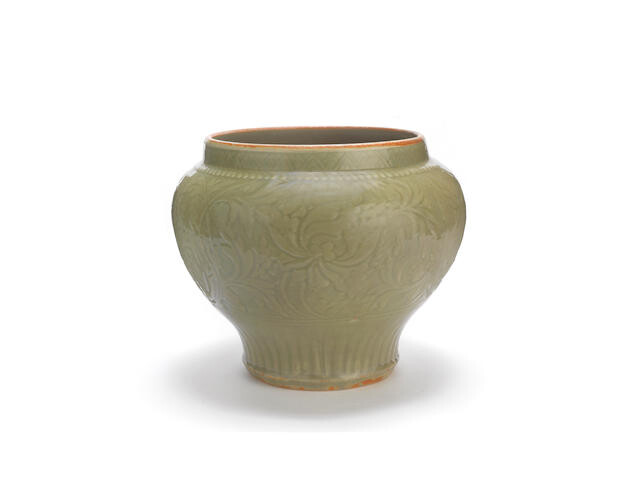 A carved Longquan celadon-glazed jar, guan