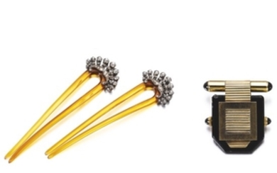 Lapel watch and a pair of combs, circa 1900
