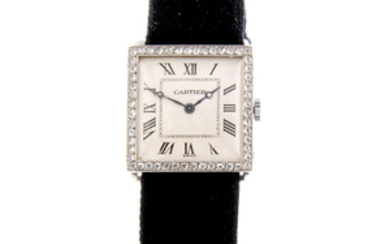 CARTIER - a white metal wrist watch.