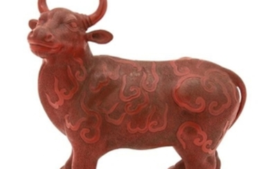 A Chinese Carved Composite Red Lacquer Model of a Bull