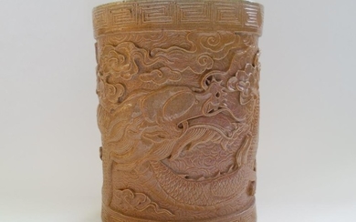 A Chinese Glazed Pottery Brush Pot Decorated With A Carved Dragon