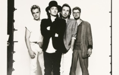 *DAVID BAILEY (b.1938) U2, LIVE AID, 13 JULY 1985 Gelatin silver print, printed 1985, signed on ...