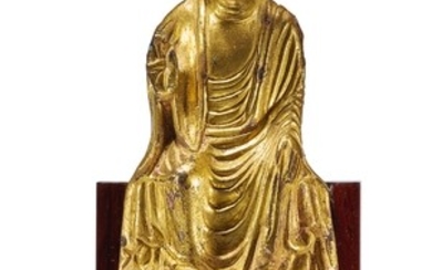 A GILT-BRONZE FIGURE OF A SEATED BUDDHA EARLY TANG DYNASTY