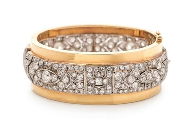 A Platinum, Yellow Gold and Diamond Bangle Bracelet