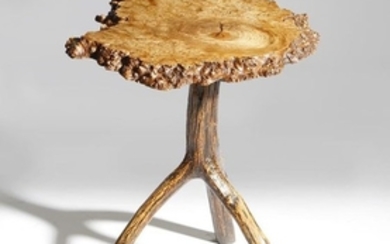 A primitive burr wood table, the rustic ash top on…