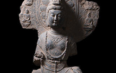 A very rare grey limestone figure of Avalokiteshvara