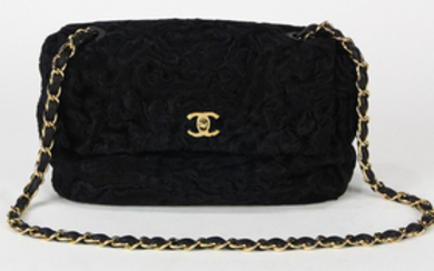 Chanel Persian lamb medium flap handbag, executed in black, with strap, label to interior, Neiman Marcus tag, and dust bag; Provenan...