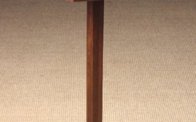 A 19th Century Cherrywood Candlestand. The octagonal top with applied edging strips, standing on an