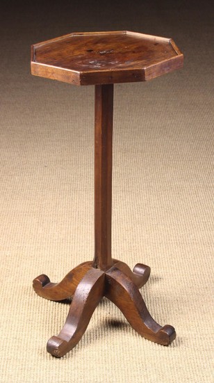A 19th Century Cherrywood Candlestand. The octagonal top with applied edging strips, standing on an