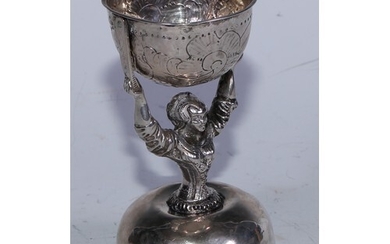A 19th century continental silver wager or bridal cup, embos...