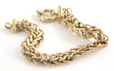 A 9ct gold bracelet, with V shaped and hammered...