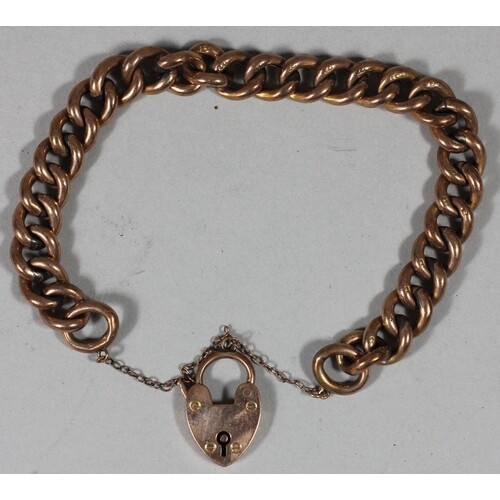 A 9ct rose gold hollow curb bracelet with heart padlock, 15....