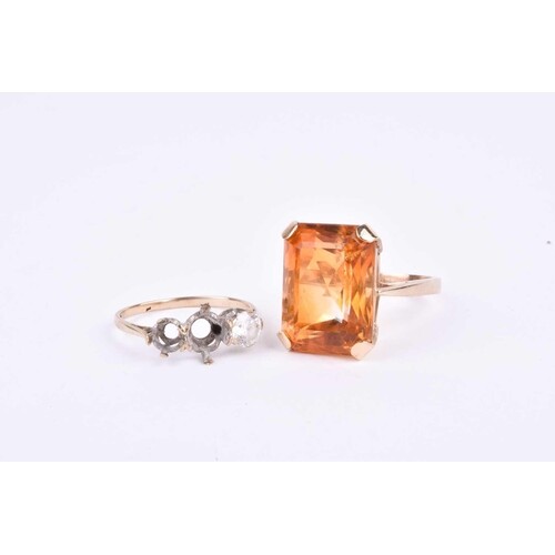 A 9ct yellow gold and citrine dress ring, set with a large r...