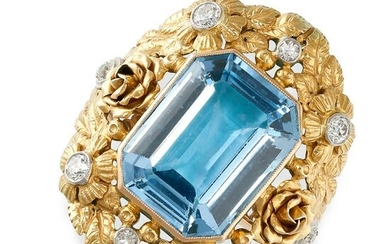 A BLUE GEMSTONE AND DIAMOND RING set with a step cut