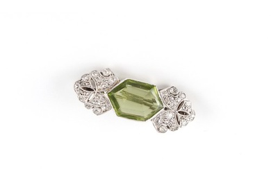 A Belle Epoque style peridot & diamond brooch, the hexagonal...