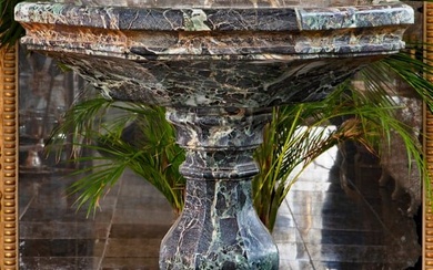 A CARVED VARIEGATED GREEN MARBLE BASIN OR CISTERN, LATE 19TH OR EARLY 20TH CENTURY