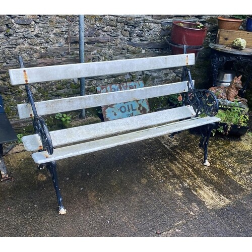 A CAST IRON TWO SEATER GARDEN SEAT, 114cm wide