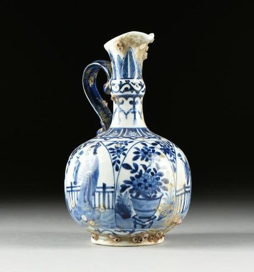 A CHINESE BLUE AND WHITE PORCELAIN EWER, SHIPWRECK