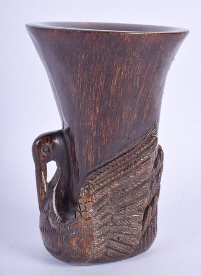 A CHINESE CARVED BUFFALO HORN TYPE LIBATION CUP. 11 cm