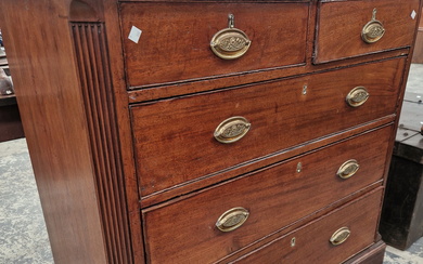 A GEORGIAN CROSS BANDED MAHOGANY CHEST OF TWO SHORT AND THREE LONG DRAWERS ON BRACKET FEET. W