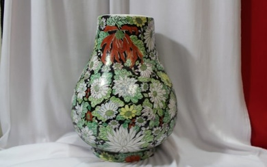 A Chinese Famille Noire Center Vase