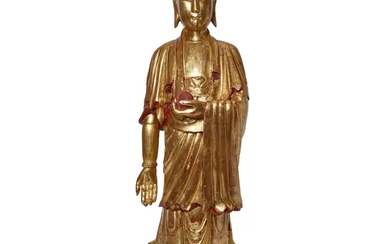 A Chinese painted and gilt-lacquered wood standing figure of Buddha Ming dynasty...