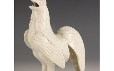 A Chinese porcelain Blanc De Chine model of a cockerel, circ...