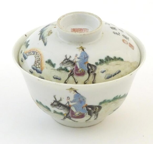 A Chinese tea bowl and cover decorated with a landscape