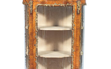 A French late 19th/early 20th century gilt brass mounted rosewood serpentine vitrine