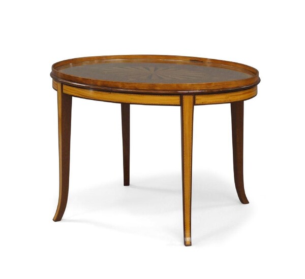 A George III oval mahogany and satinwood tray, late 18th century, marquetry inlaid with a fan paterae and scrolling foliage, on a later stand, 49cm high, 70cm wide, 52cm deep