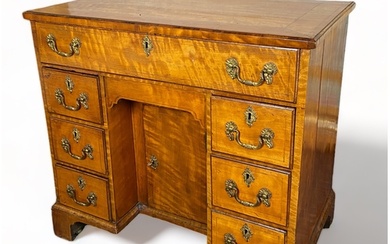 A George III satinwood kneehole desk Inlaid with boxwood li...