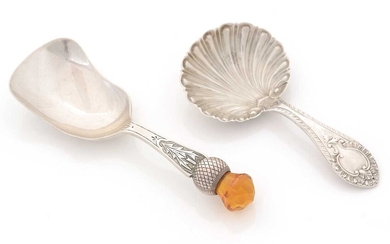 A George V silver Scottish market caddy spoon; and a Victorian silver spoon.