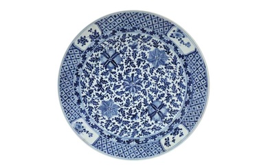 A LARGE CHINESE BLUE AND WHITE 'FLORAL' CHARGER 十九至二十世紀 青花纏枝蓮紋大盤 《大清康熙年製》款
