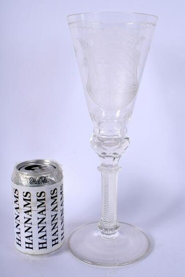 A LARGE EDWARDIAN CRYSTAL GLASS GOBLET engraved with an
