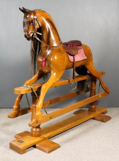 A Large Modern Walnut Rocking Horse, by Stevenson Brothers,...