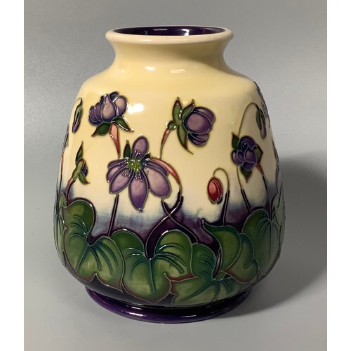A Moorcroft pottery vase of ovoid form with flared rim, deco...