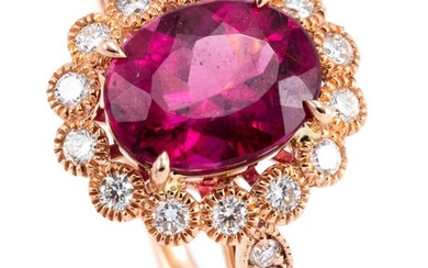 A PINK TOURMALINE AND DIAMOND CLUSTER RING; centring a 2.53ct rubellite to surround and shoulders set with 18 round brilliant cut di...